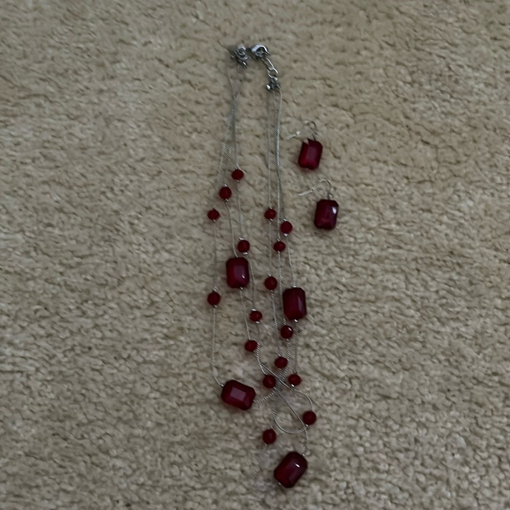 Layered red beaded necklace and drop earrings